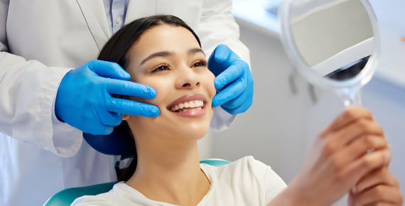 dentist checking patient smile